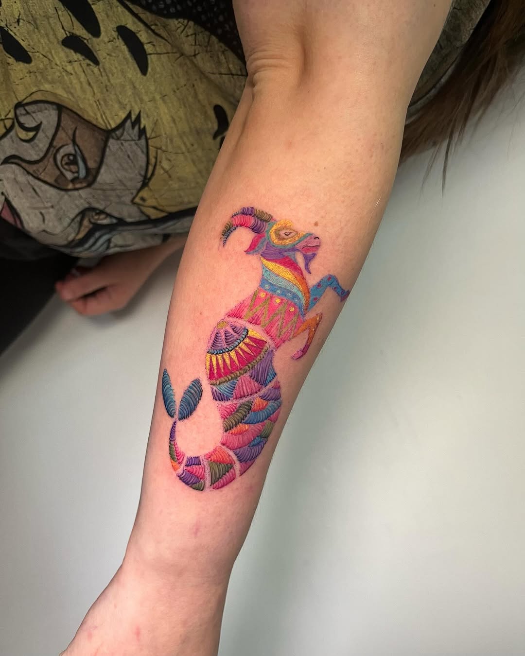 Colorful Capricorn Tattoo with Unique patterns