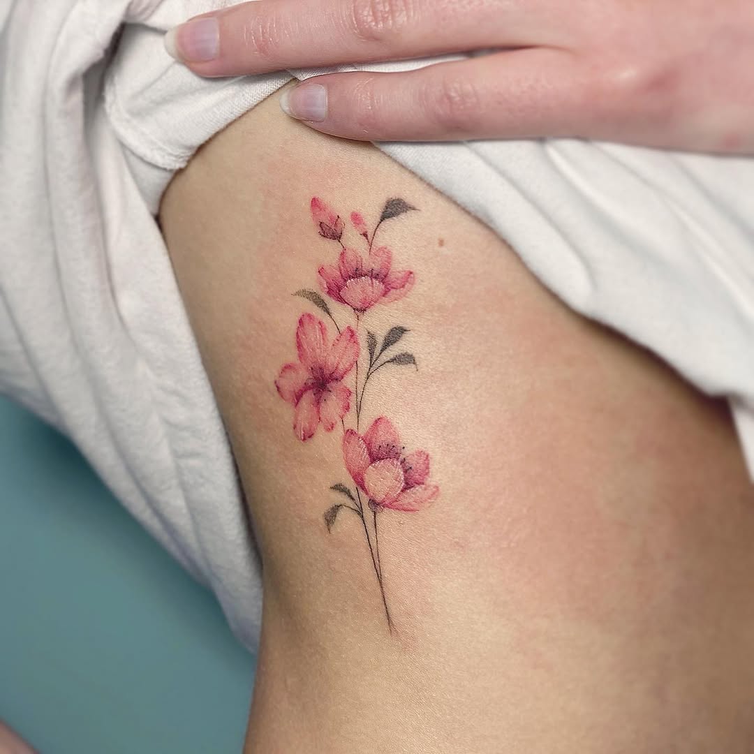 elegant cherry blossom tattoo on soft skin