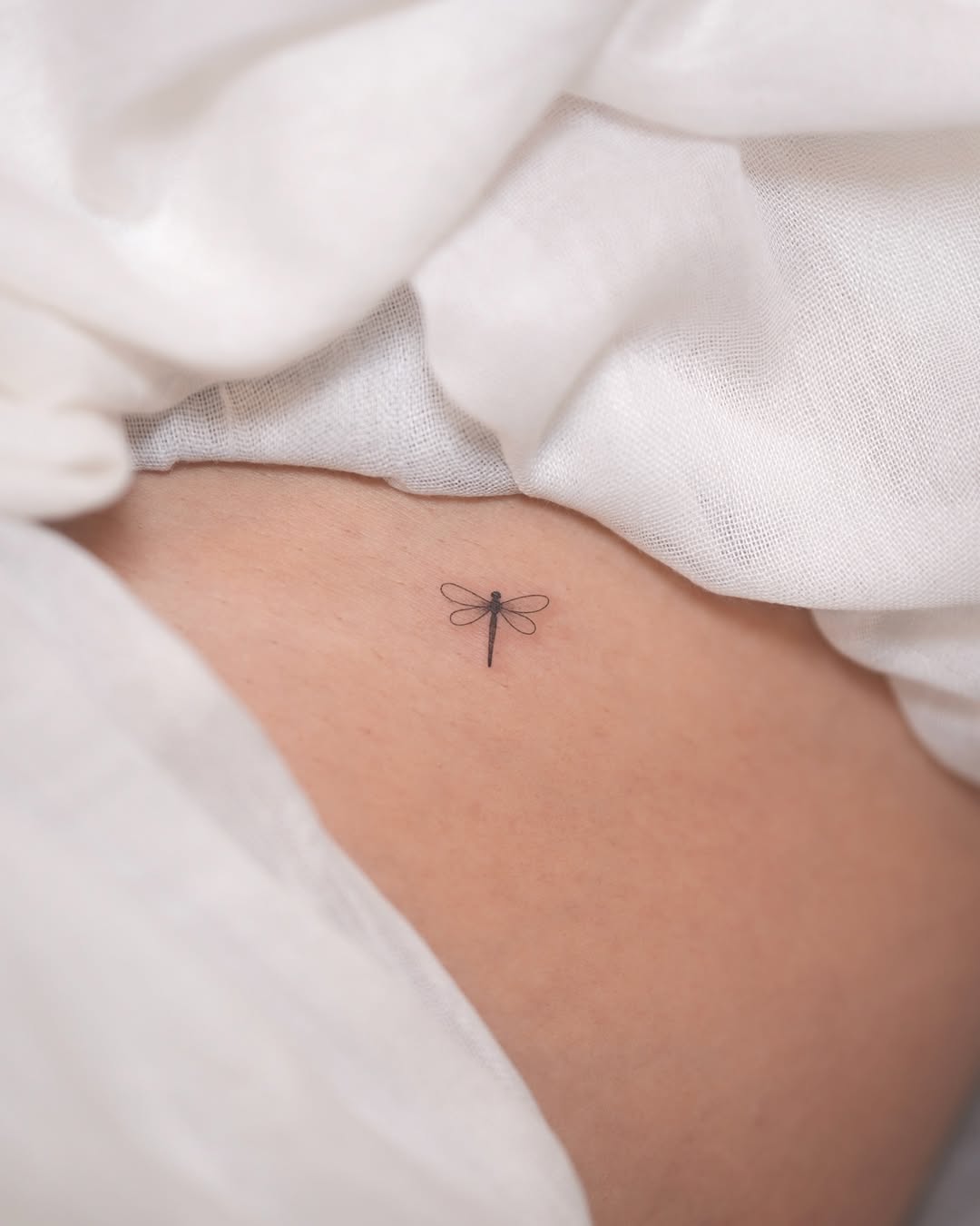 Elegant Minimalist dragonfly Tattoo Design
