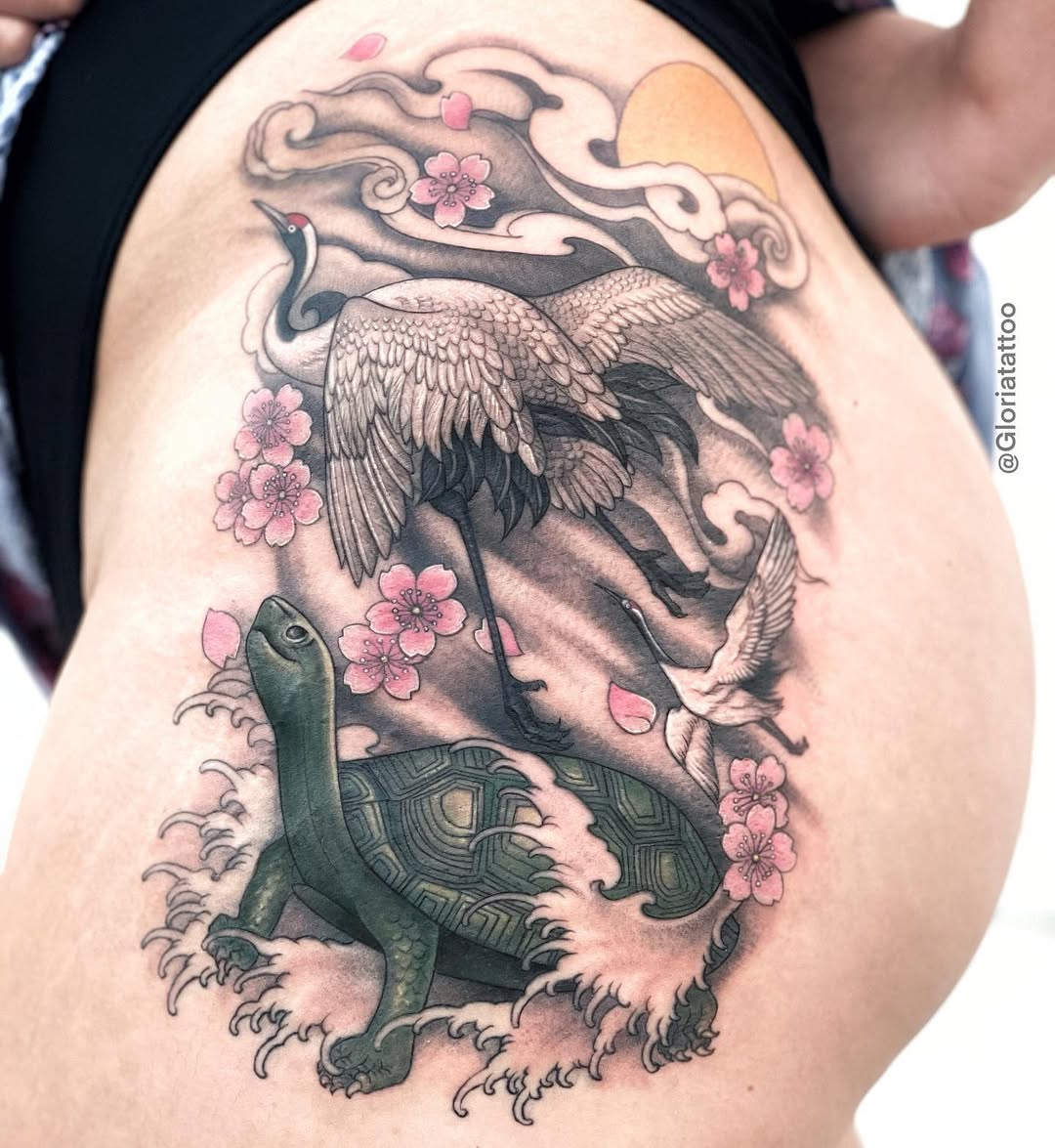 elegant sea turtle tattoo with floral accents.