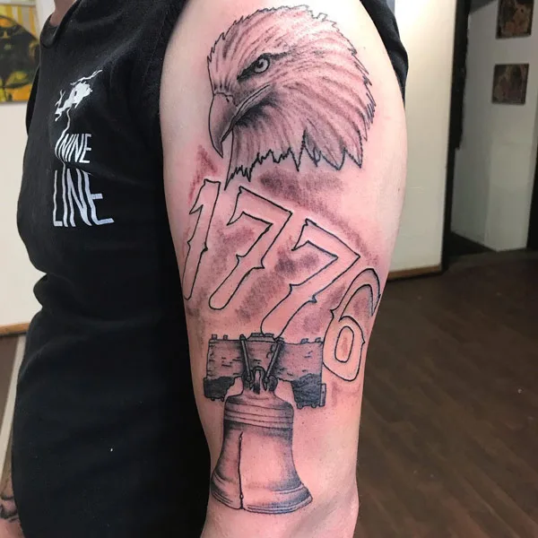 1776 tattoo on arm