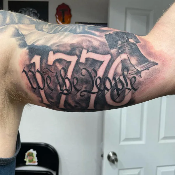 1776 tattoo on bicep