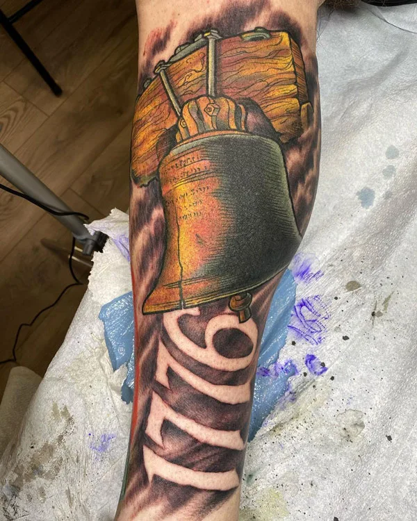 1776 tattoo on leg