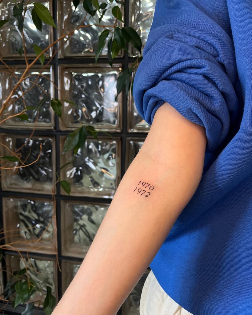 1970 and 1972 Text Tattoos Aligned Sequentially on the Forearm: Timeless Years