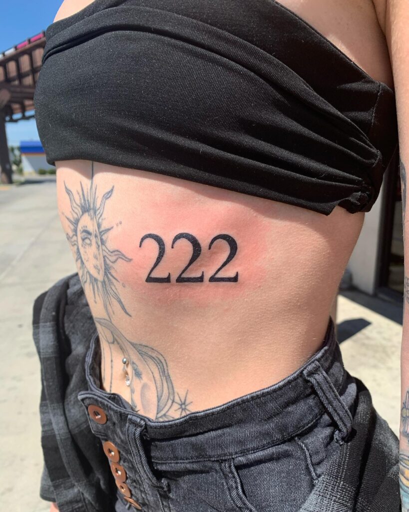 222 Bold Tattoo on the Above the Side Stomach, a Defining Mark: Stomach Statement 