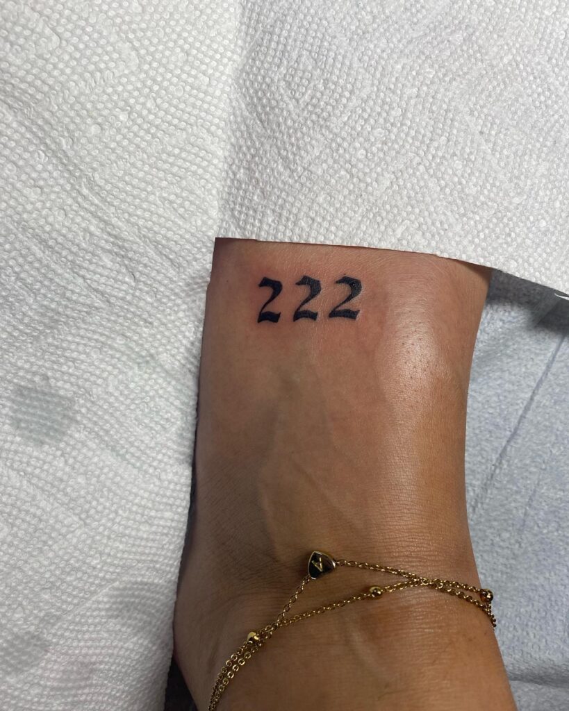 222 Tattoo on the Foot for Females in Boldline, a Grounded Emblem: Foot Flourish 