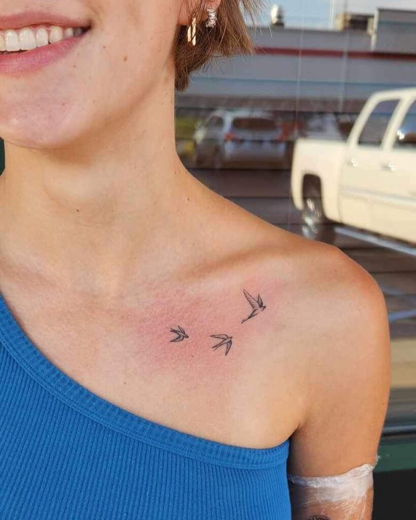 3 little birds side view tattoo on the collarbone, a musical and meaningful design melodic trio