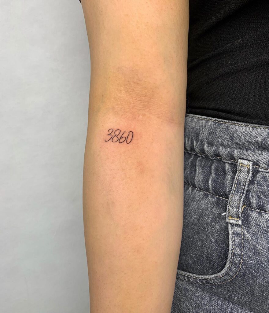 '3860' Number Tattoo Below the Elbow: Numerical Charm