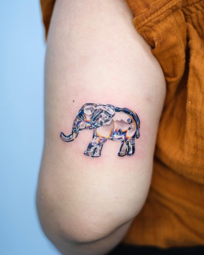 3D Elephant Tattoo with Glass Color Realism on the Elbow, Side View: Glass Color Realism