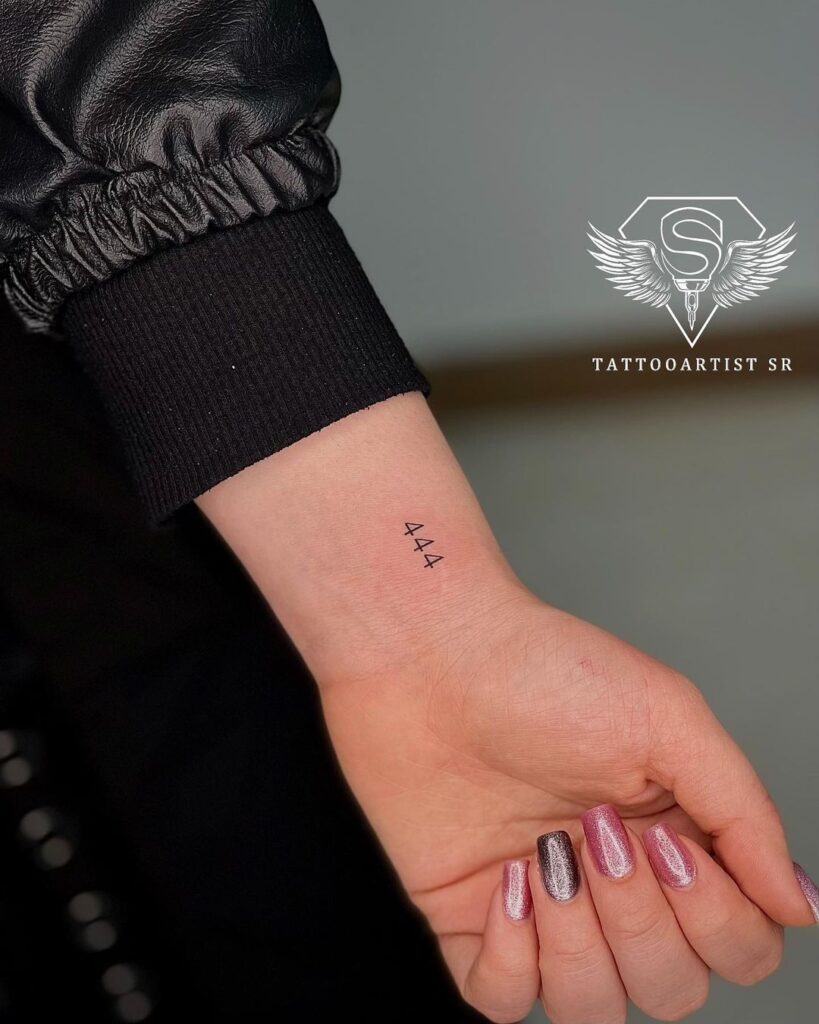 444 angel number tattoo on the wrist numerology-inspired ink