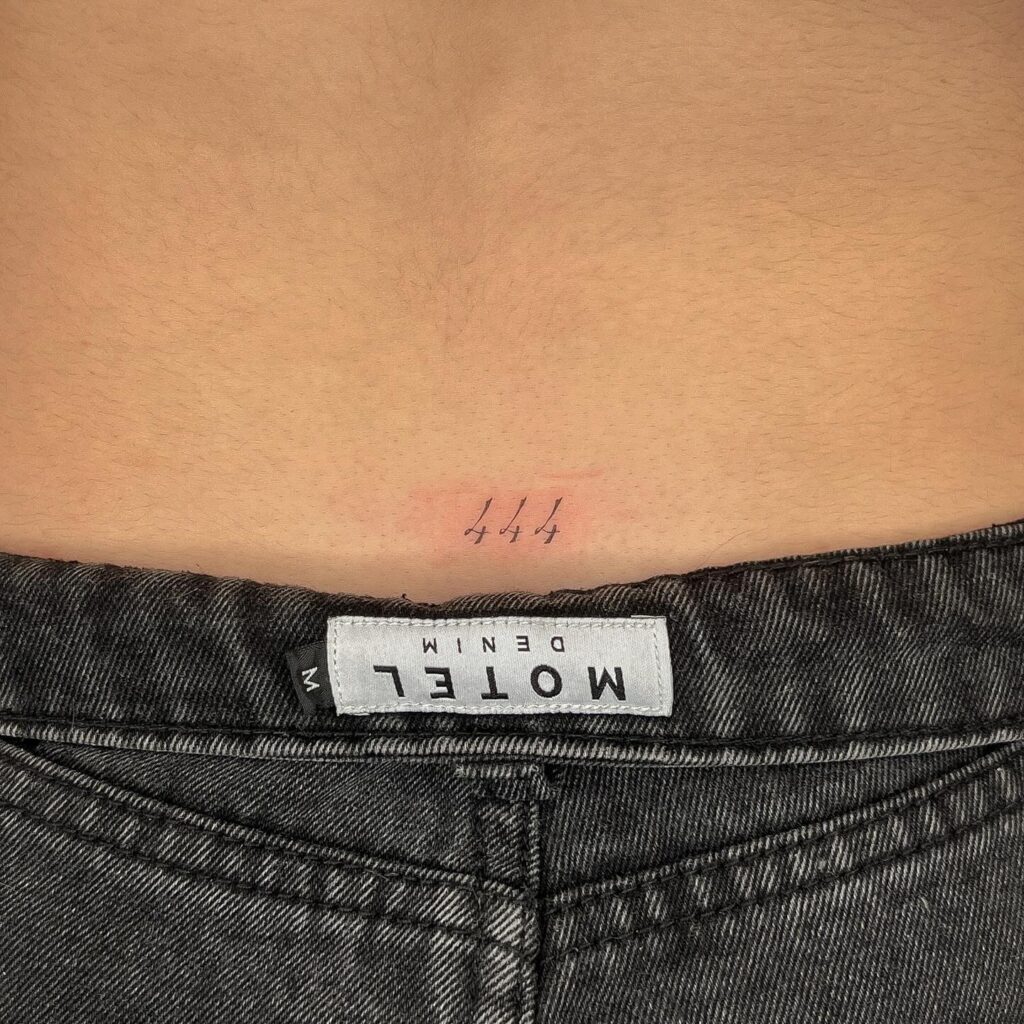 '444' Fineline Text Lettering Tattoo on the Lower Back: Numerical Harmony