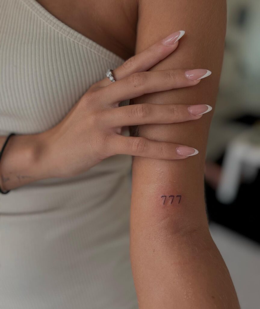 777 Angel Number Above the Elbow for a Stylish Statement: Elbow Accent 