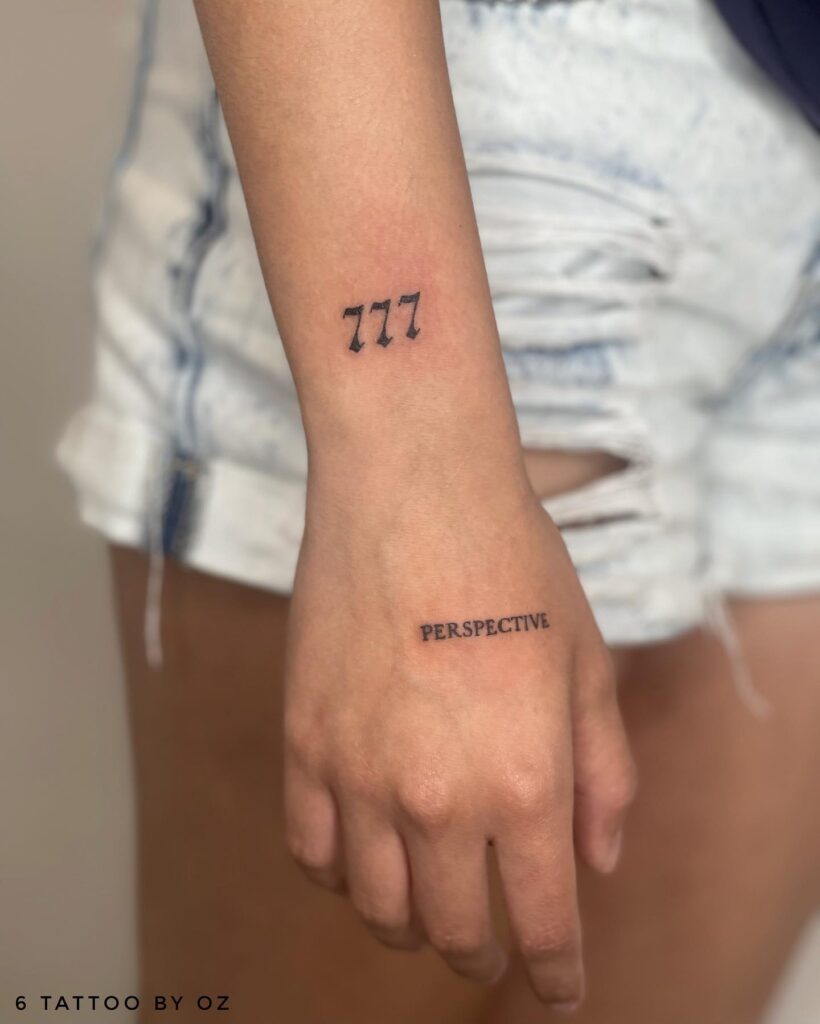 777 Number Tattoo on the Outer Wrist in Minimalistic Style: Wrist Elegance 