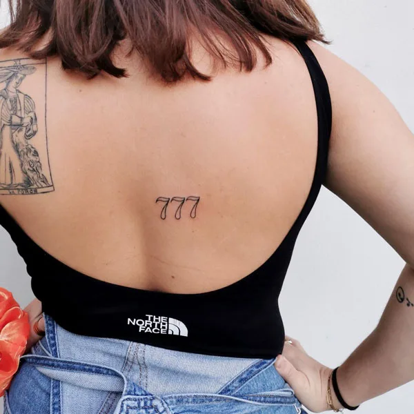 777 tattoo 26