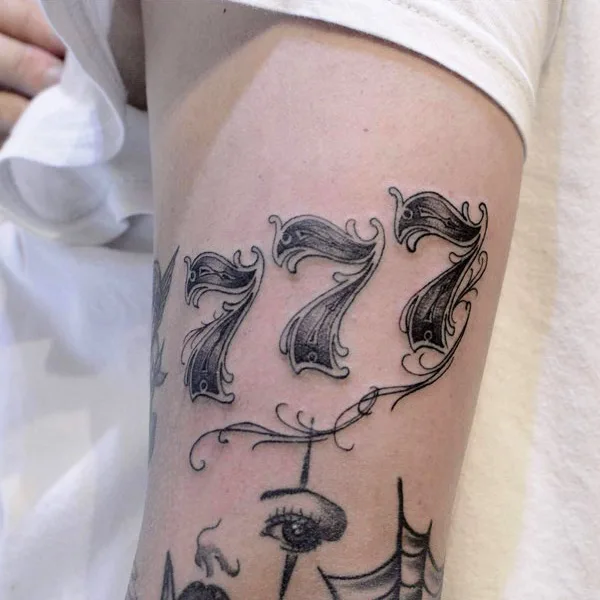 777 tattoo 31