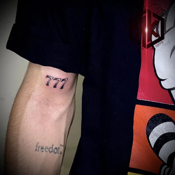 777 tattoo 69