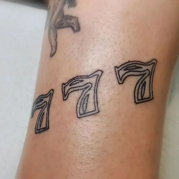 777 tattoo 70