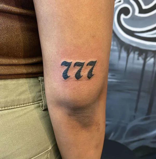 777 tattoo 90