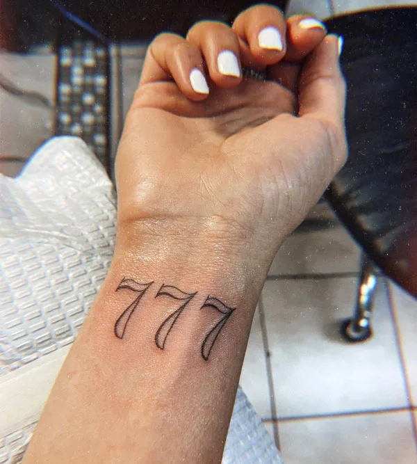 777 tattoo on wrist
