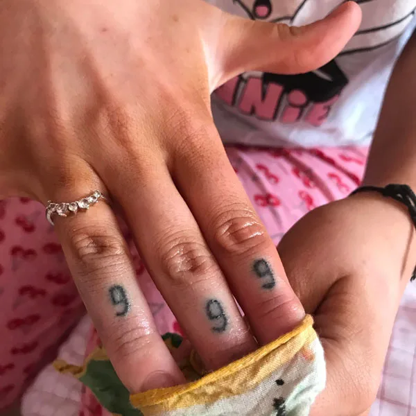 999 tattoo on finger 1