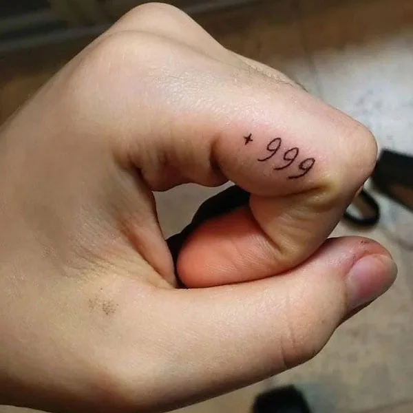 999 tattoo on finger 4
