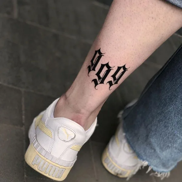 999 tattoo on leg 2