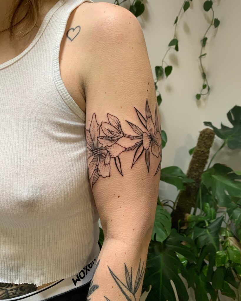 A band of blooms little flower armband tattoo for the arm