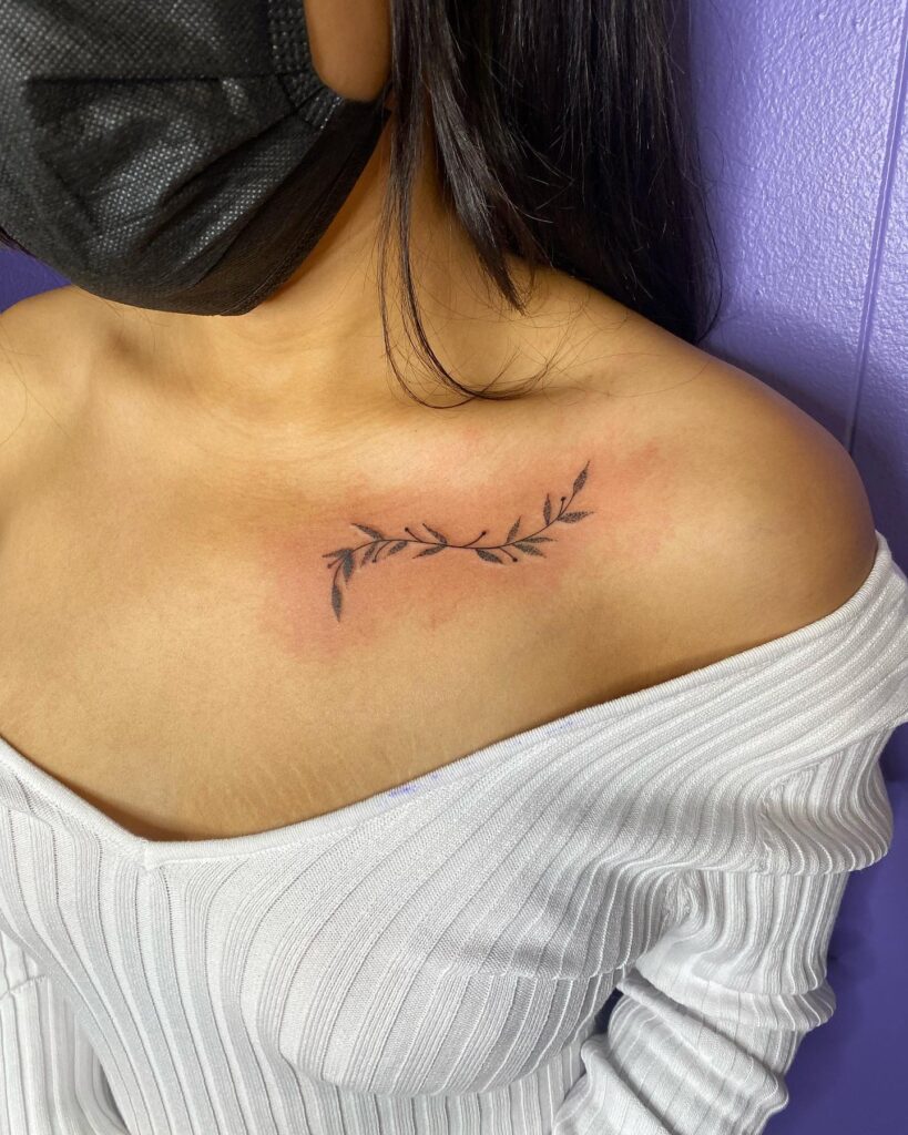 A delicate vine accent on the collarbone, tracing the lovely bones vine whispers
