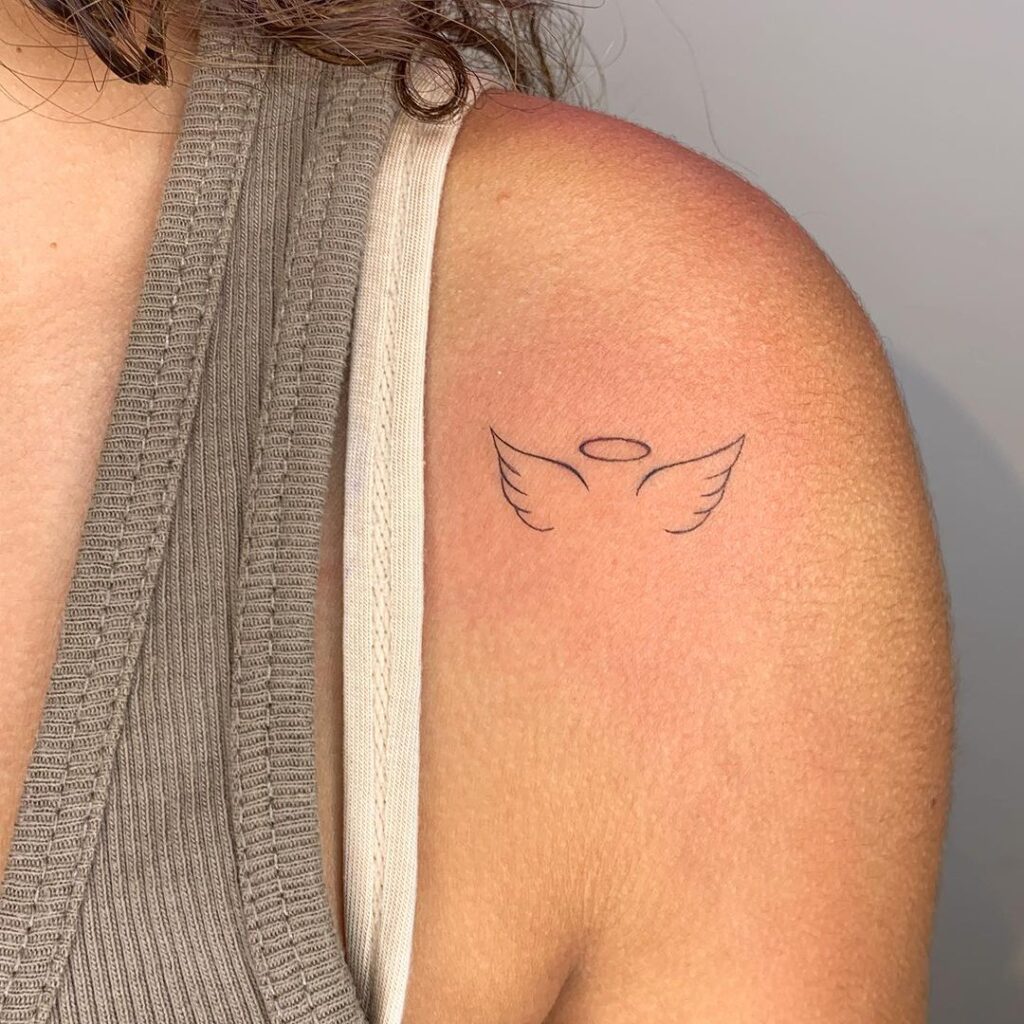 A divine touch outline angel wings tattoo on the shoulder