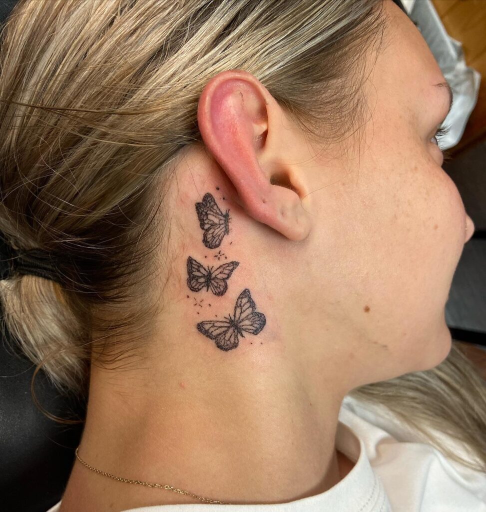 A trio of monarchs three moving butterfly tattoos behind the ear