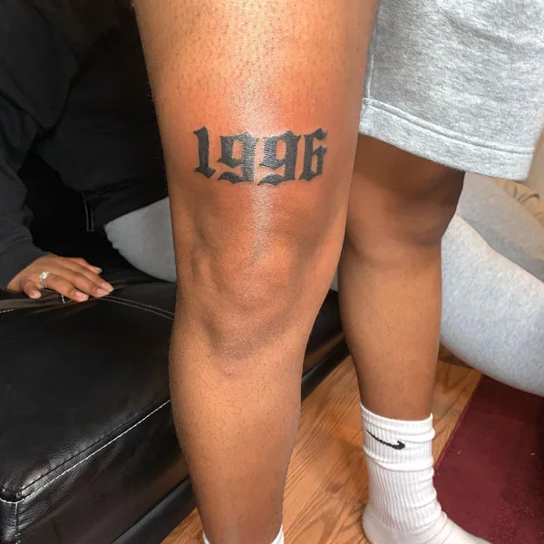 Above knee date tattoo