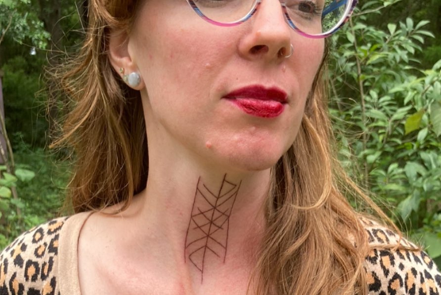 Abstract Tattoo Design for Women on the Front of the Neck