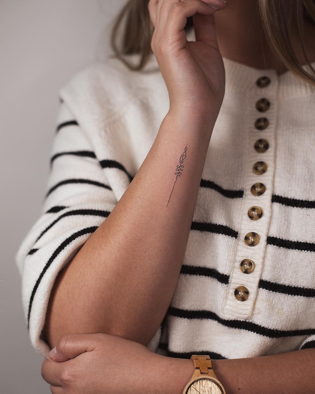 Abstract Flowing Line Tattoo on Forearm Representing Growth & Transformation