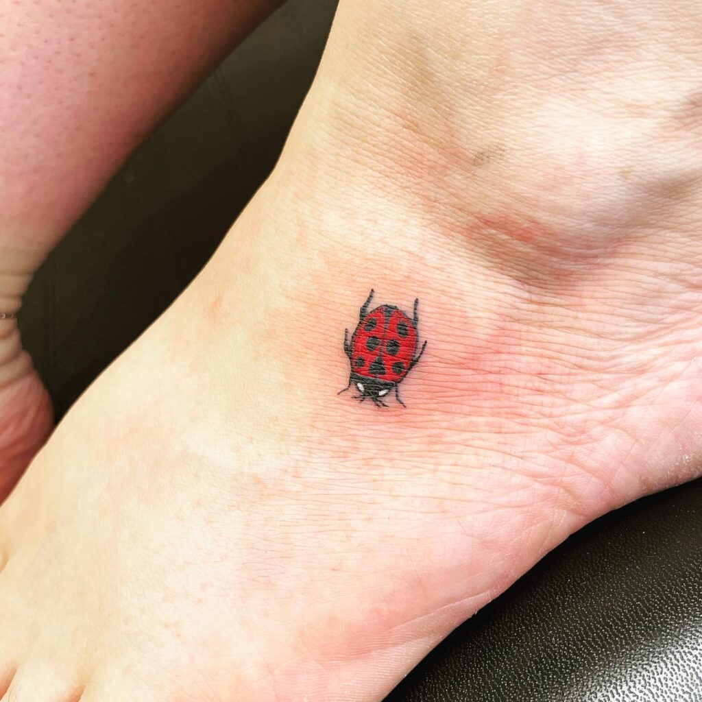 Adorable Little Red Ladybug Tattoo on Foot A Playful and Cute Expression