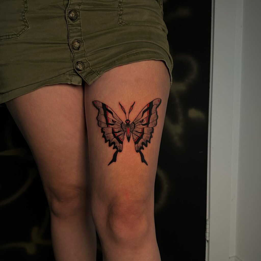 Aerial beauty swallowtail butterfly tattoo on thigh for females