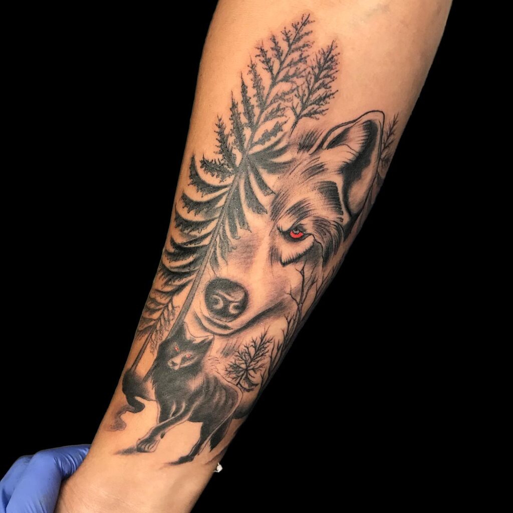 Alpha male black wolf with red eyes forearm tattoos