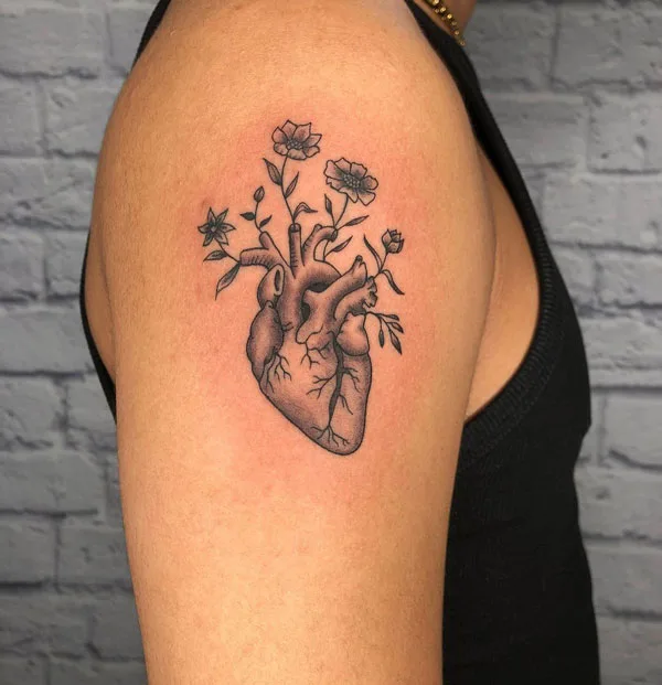 Anatomical heart tattoo on arm