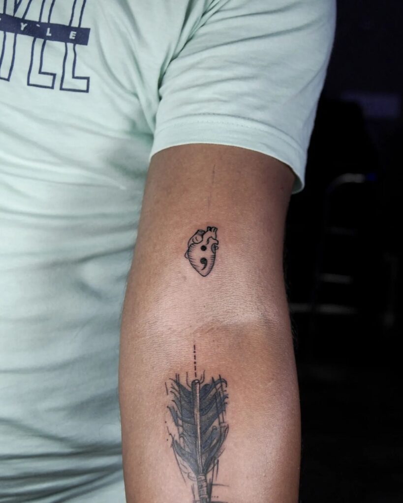 Anatomical Heart with a Semicolon Above the Elbow: Vivid Fusion