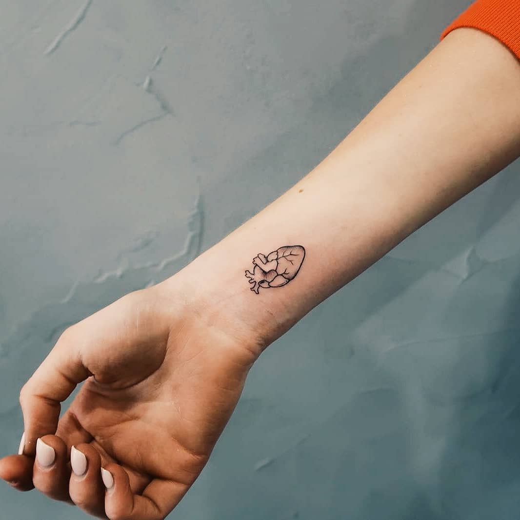 Anatomical Heart Wrist Tattoo Small and Artistic Representation of Deep Emotions