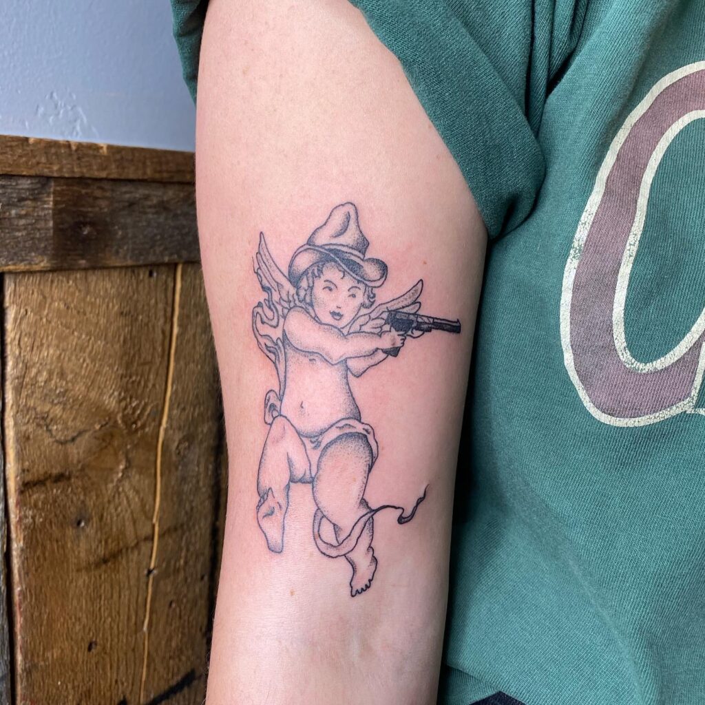 Angel With Gun Tattoo on the arm Design with image