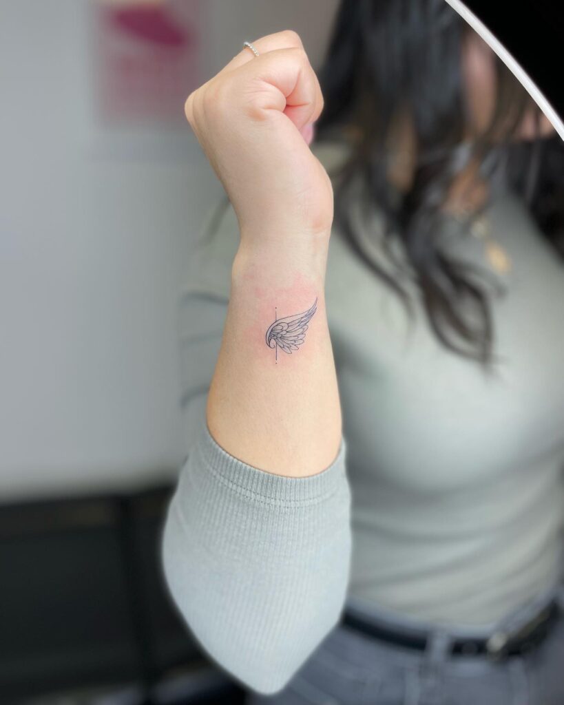 Angel Baby Wing Tattoo on the Side of the Wrist, a Small Side View: Angelic Whispers