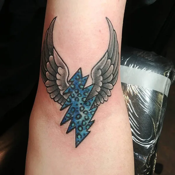 Angel wing lightning bolt tattoo