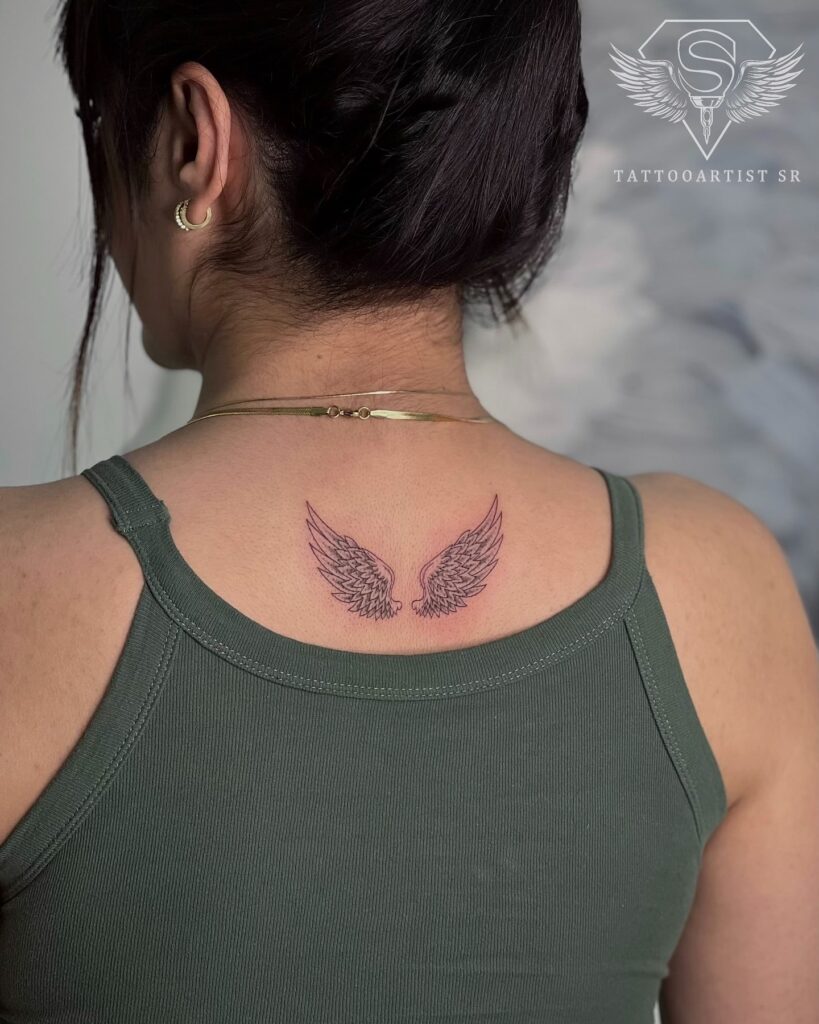 Angel Wings Tattoo Adorning the Back of the Neck: Celestial Nape