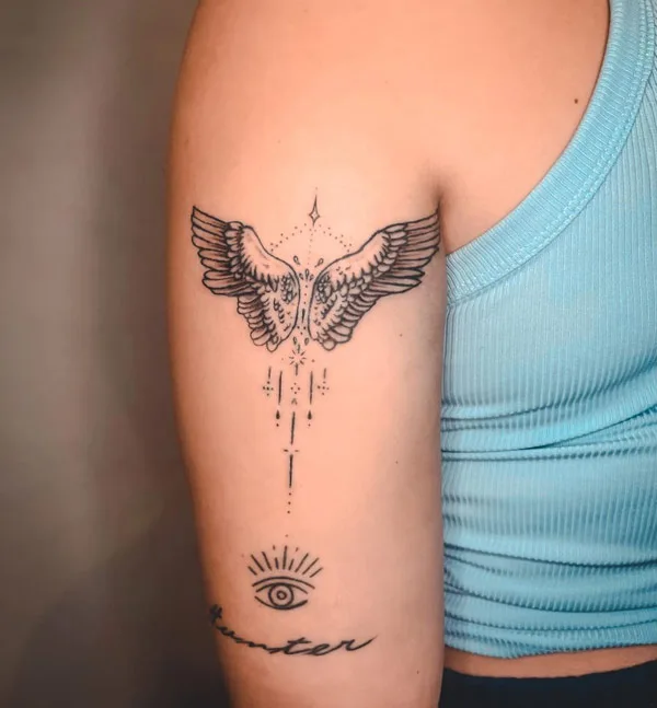 Angel wings tattoo on arm 2