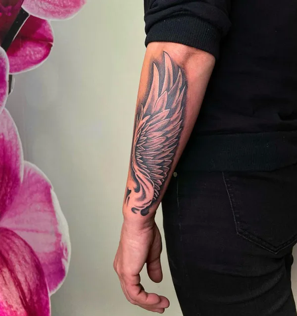 Angel wings tattoo on forearm 1