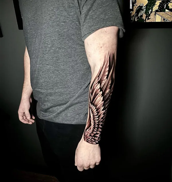 Angel wings tattoo on forearm 2