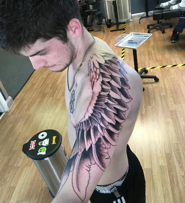 Angel wings tattoo on shoulder