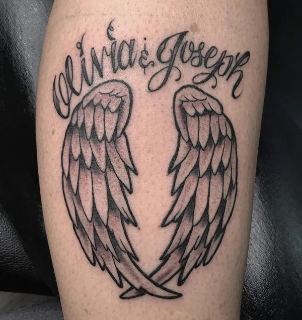 Angel wings tattoo with name 2