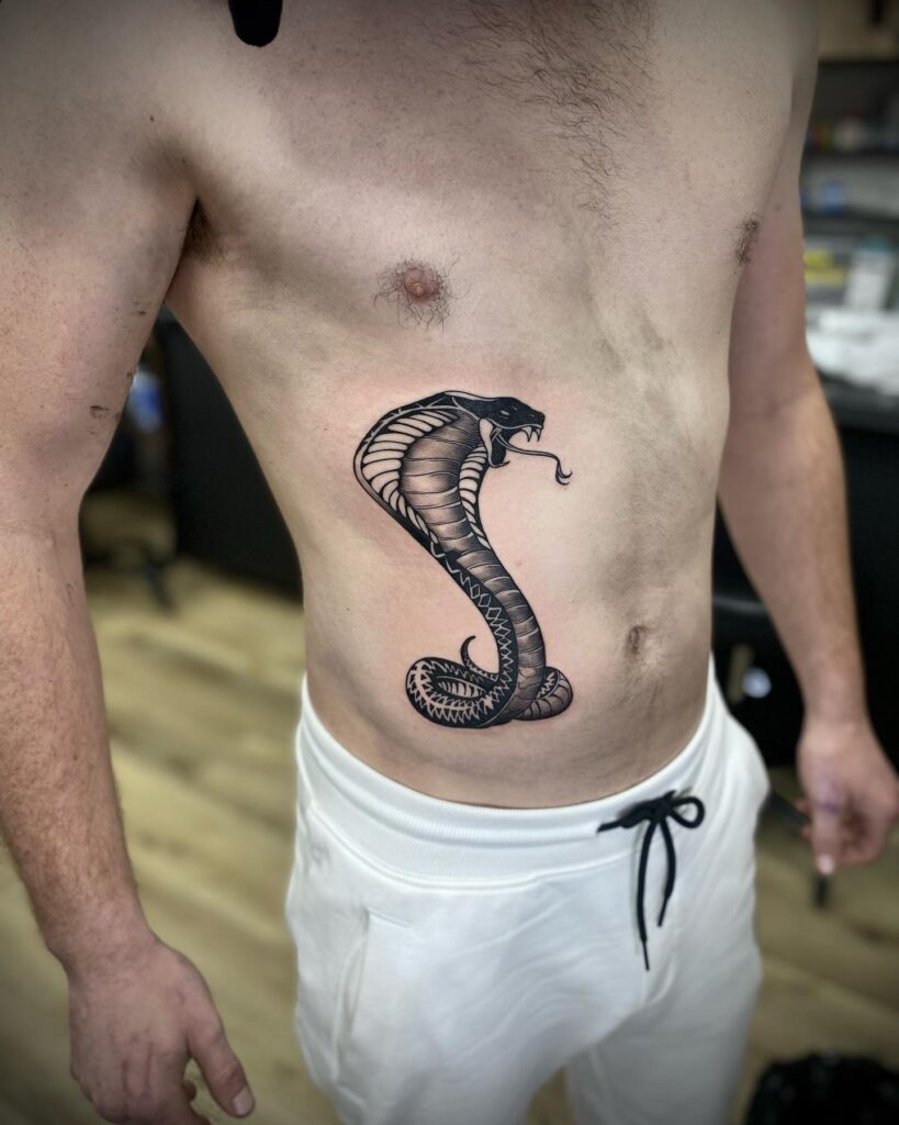 Angry Cobra Tattoo for Men, Head Up with an Elegant Tongue: Ribbed Rebellion