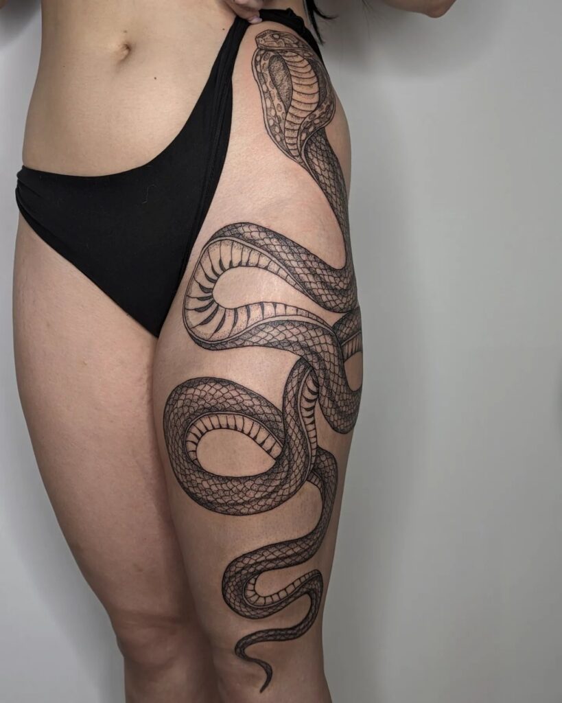Angry King Cobra Tattoo, Hip to Knee with a Striking Pattern: Fierce and Unyielding
